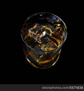 Whiskey with ice in simple glass on black background