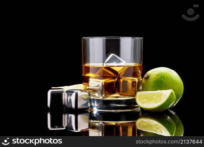 Whiskey with steel cooling cubes on dark glass background.. Whiskey with steel cooling cubes on dark glass background