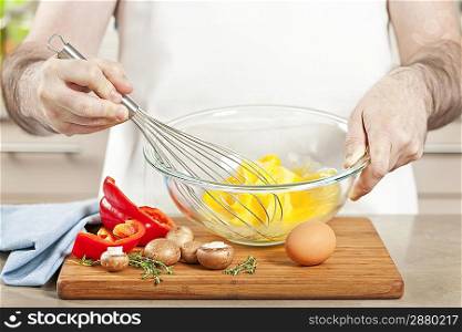 Whisking eggs in bowl