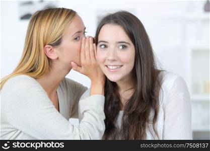 Whispering a secret to a friend