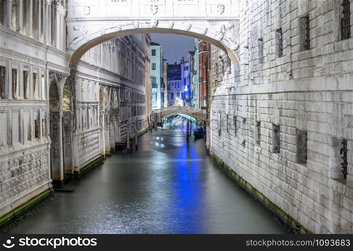 Whispers Bridge at night in Venice, Italy.