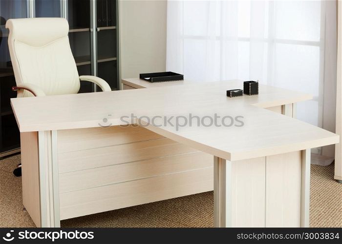 white and a large desk in a modern office
