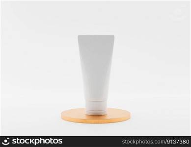 White and blank, unbranded cosmetic cream tube standing on golden podium. Skin care product presentation on white background. Elegant mockup. Skincare, beauty and spa. 3D rendering. White and blank, unbranded cosmetic cream tube standing on golden podium. Skin care product presentation on white background. Elegant mockup. Skincare, beauty and spa. 3D rendering.