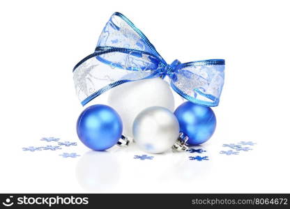 White and blue Christmas balls with a beautiful bow and confetti snowflakes on a white background