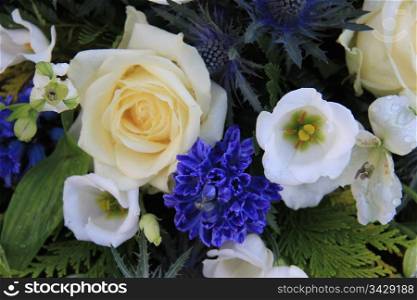White and blue flower arrangement, white roses and blue hyacints