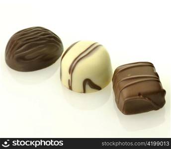white and dark chocolate candies on white background