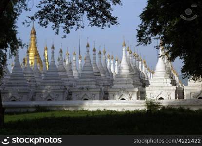 White and golden stupas in Sandamani Paya, Mandalay, Myanmar