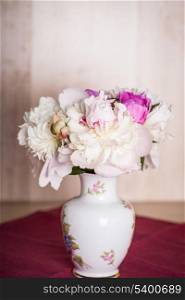 White and pink peonies in vase