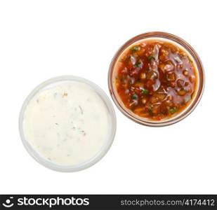 White and red sauces isolated on a white background