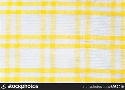 White and yellow checked cotton fabric texture closeup