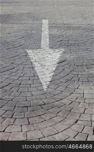 White arrow on a grey road with texture
