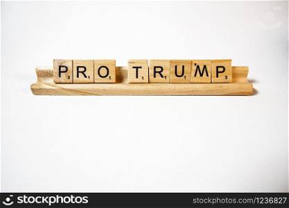 White background scrabble pieces spell pro Trump