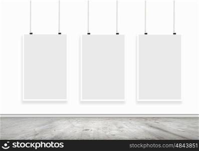 White banner. Blank white banner hanging on wall. Place for text