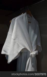 white bathrobe in wardrobe