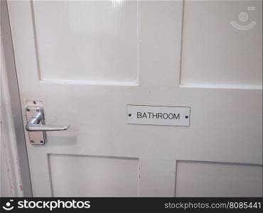 White bathroom door detail. Detail of a white bathroom door in a hotel