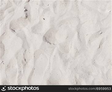 White beach sand as a background. Beach sand background