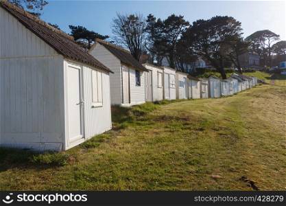 White beach sheds at Ris beach in Douarnenez
