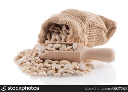 White beans bag with wooden scoop on white background.