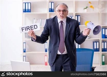 White bearded old businessman employee unhappy with excessive work   . White bearded old businessman employee unhappy with excessive wo