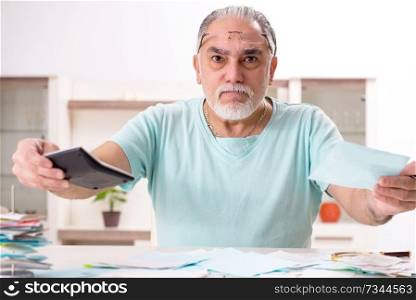 White bearded old man in budget planning concept 