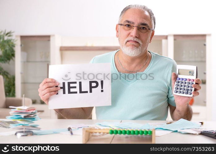 White bearded old man in budget planning concept 