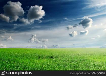 white beautiful clouds and spring field
