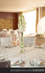 White beautiful table set for a wedding dinner