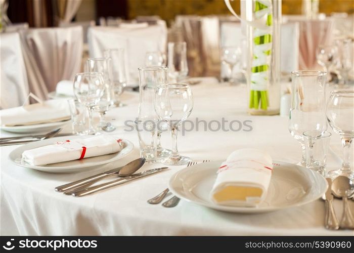White beautiful table set for a wedding dinner