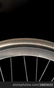 White Bicycle Wheel, Rim, Tyre and Spokes on Black Background