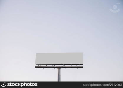 white blank billboard against blue sky