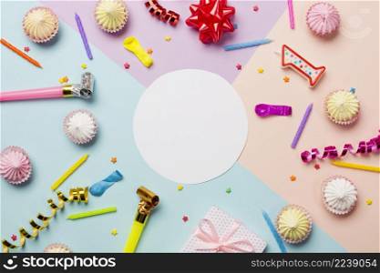 white blank circle frame surrounded with aalaw sprinkles streamers balloon candles colored backdrop