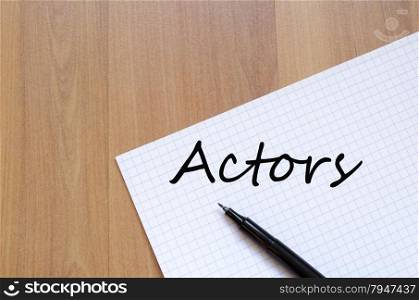 White blank notepad on office wooden table Actors concept