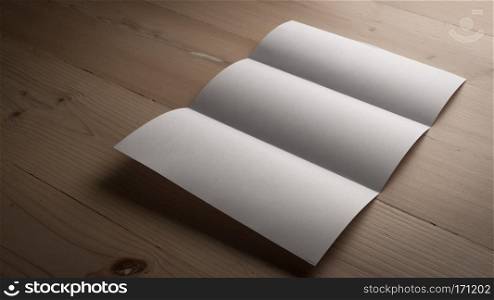White blank paper notepad on wooden table.