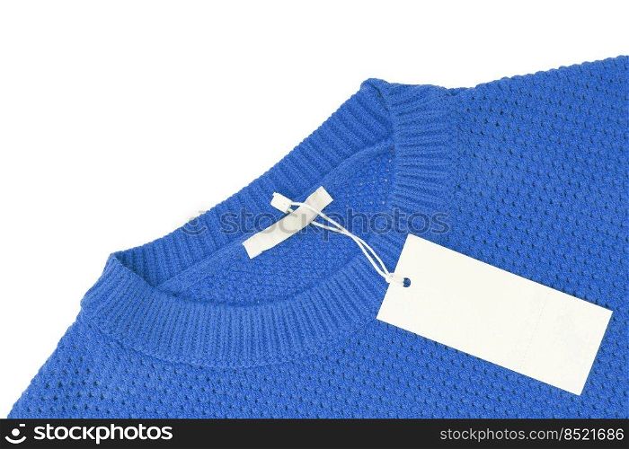 White blank rectangular clothing tag, label mockup template on blue knitted sweater isolated on white background . Price tag label with copy space for text. Shopping, sale, discount, black friday. White blank rectangular clothing tag on blue knitted sweater isolated on white background