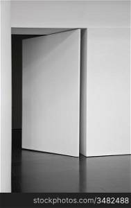white blank wall with open door photo