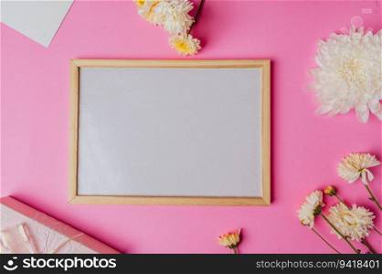 white board with flower on pink background