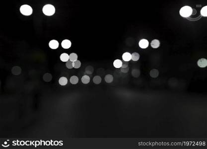white bokeh lights black background. High resolution photo. white bokeh lights black background. High quality photo