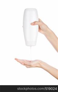 White bottle of shower gel lotion cream in hands pattern on a white background isolation