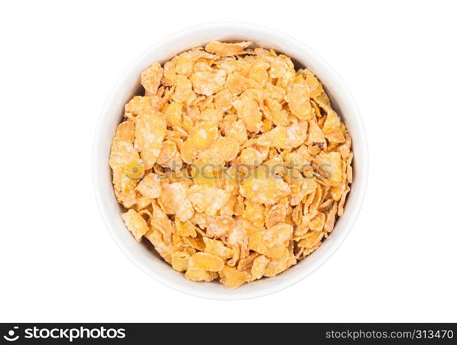 White bowl with natural organic granola cereal corn flakes on white.Top view