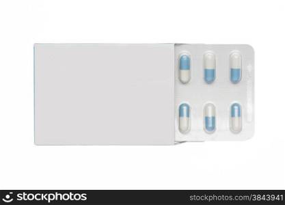 White box with white-blue capsules blister pack on an isolated background. White box with white-blue capsules blister