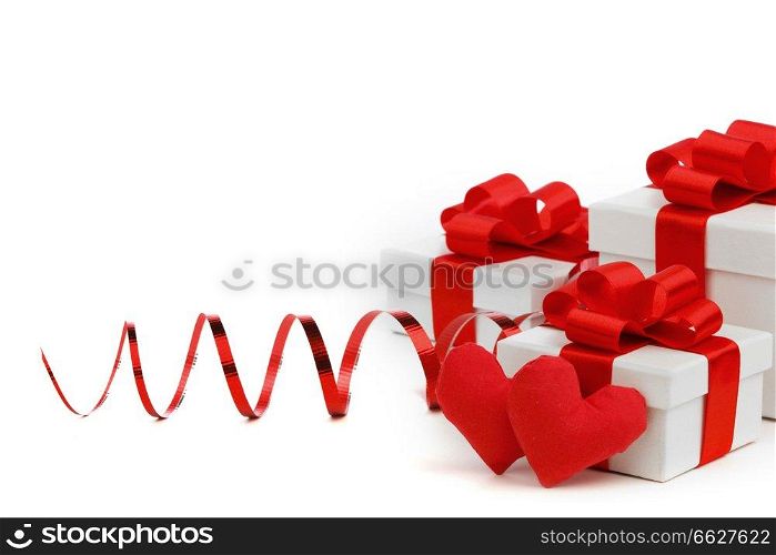White boxes with red handmade hearts and decorative hearts isolated on white background