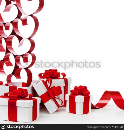 White boxes with red ribbons and decorative hearts isolated on white background. Love gifts on white