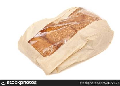 White bread with sesame in a paper bag isolated on white background
