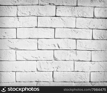 White brick wall. Grunge background from roughly a brick wall