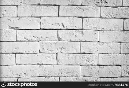 White brick wall. Grunge background from roughly a brick wall
