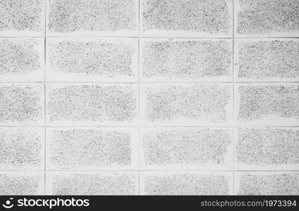 White brick wall texture abstract background. Lightweight concrete wall texture background. Simple abstract wallpaper. White rough brick wall surface. Interior wall or exterior building.