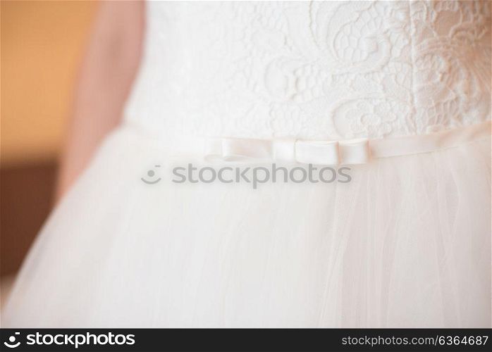 white bridesmaid dress with bow and lace