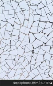 White broken tiles wall texture.