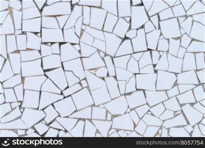 White broken tiles wall texture.