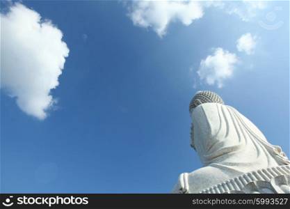 White buddha statue. White buddha statue at blue sky background